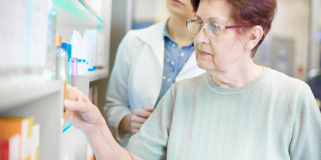 Pharmacist helping senior woman with prescription Pharmacist helping senior woman with prescription